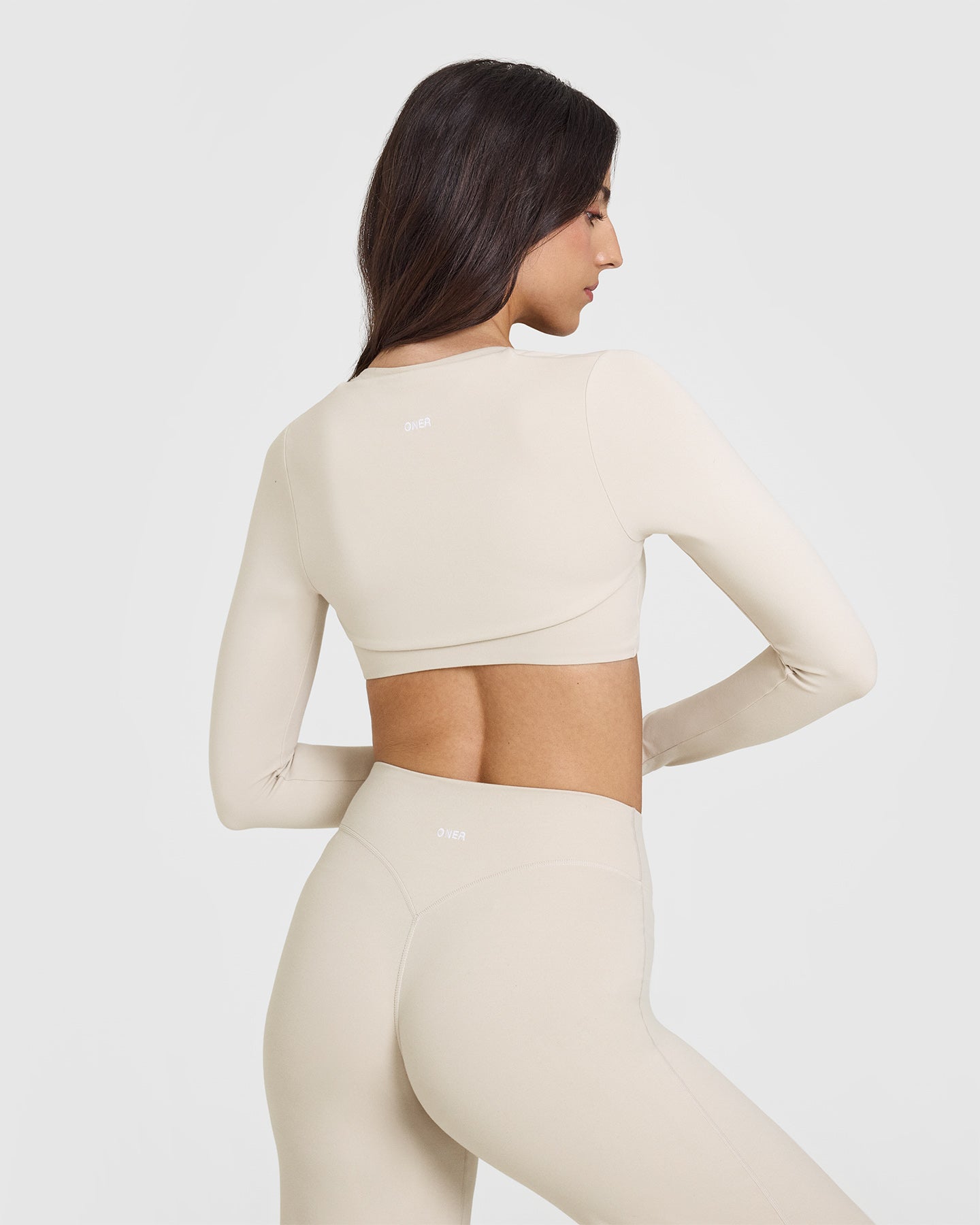 SoftMotion™ Long Sleeve Shrug with White Logo | Sand