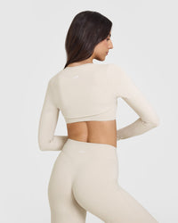 SoftMotion™ Long Sleeve Shrug with White Logo | Sand