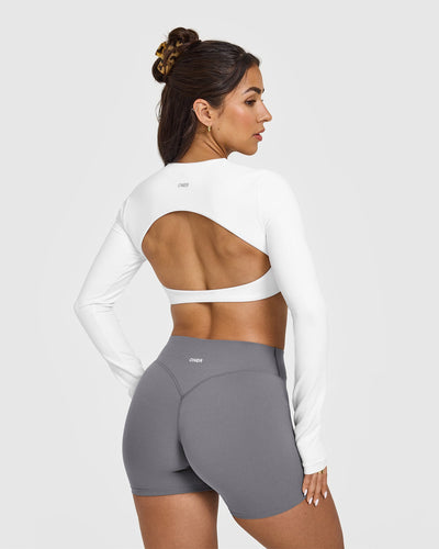 SoftMotion™ Long Sleeve Crop Top with White Logo | White