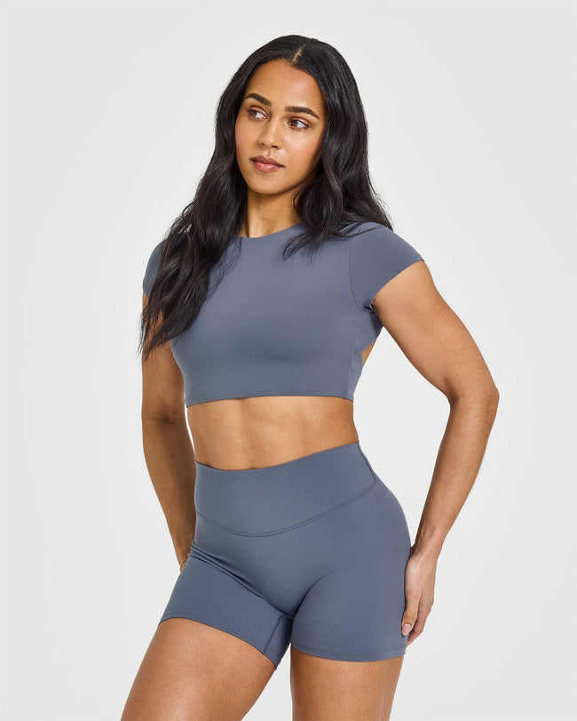 SoftMotion™ Short Sleeve Crop Top with White Logo | Granite Blue