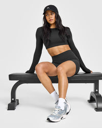 SoftMotion™ Long Sleeve Crop Top with White Logo | Soft Black