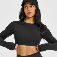 SoftMotion™ Long Sleeve Crop Top with White Logo | Soft Black