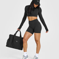 SoftMotion™ Long Sleeve Crop Top with White Logo | Soft Black