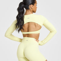SoftMotion™ Long Sleeve Crop Top with White Logo | Pastel Yellow