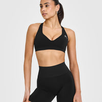 Effortless Seamless Racer Back Sports Bra with White Logo | Black