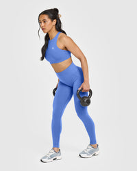 EasyLift™ High Neck Sports Bra with White Logo | Glaucous Blue