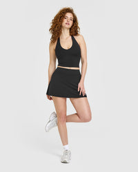 SoftMotion™ Halter Neck Mid Vest with Built in Bra Shelf with White Logo | Soft Black