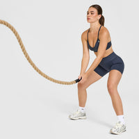 EnhanceLift™ Seamless Strappy Sports Bra with White Logo | True Blue