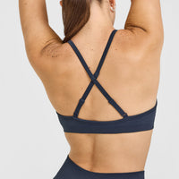 EnhanceLift™ Seamless Strappy Sports Bra with White Logo | True Blue