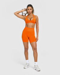 Effortless Seamless Halter Neck Sports Bra with White Logo | Flame Orange