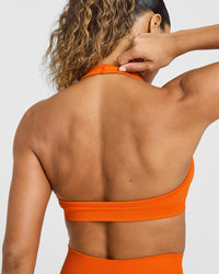 Effortless Seamless Halter Neck Sports Bra with White Logo | Flame Orange