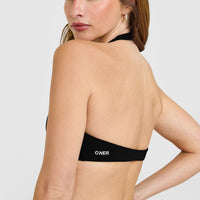 SoftMotion™ Minimal Halter Neck Bralette with White Logo | Black