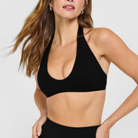 SoftMotion™ Minimal Halter Neck Bralette with White Logo | Black