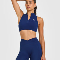 EasyLift™ Zip High Neck Sports Bra with White Logo | Midnight