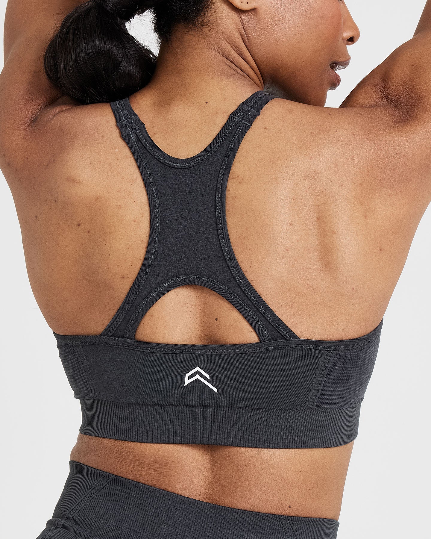 Effortless Seamless High Neck Bralette with White Logo | Coal