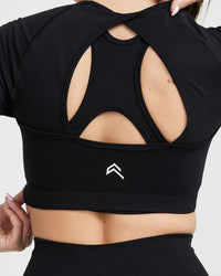 Effortless Seamless Long Sleeve Crop Top with White Logo | Black