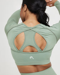 Effortless Seamless Long Sleeve Crop Top with White Logo | Sage
