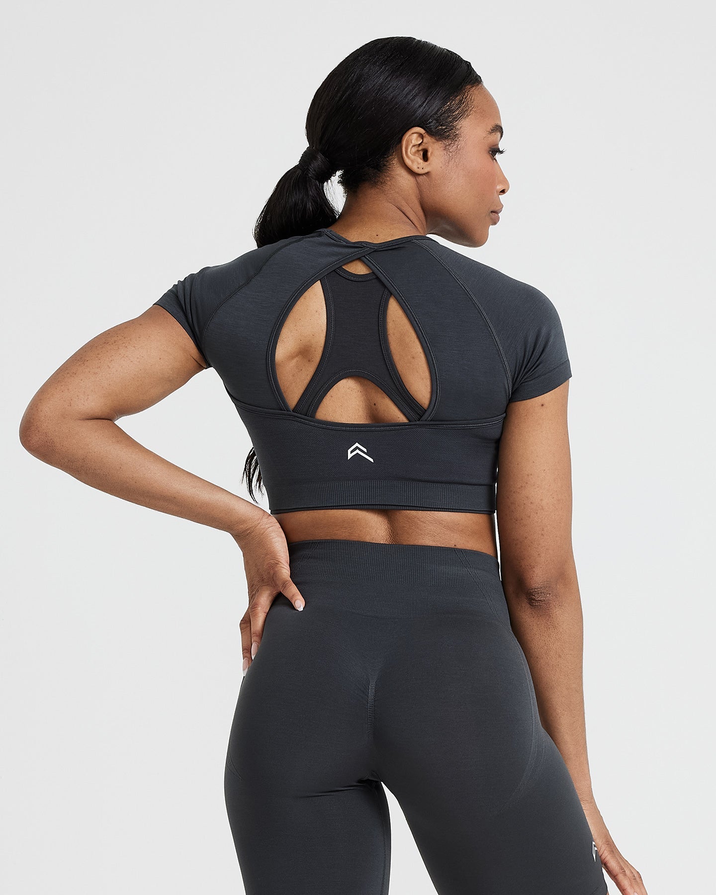 Effortless Seamless Short Sleeve Crop Top with White Logo | Coal