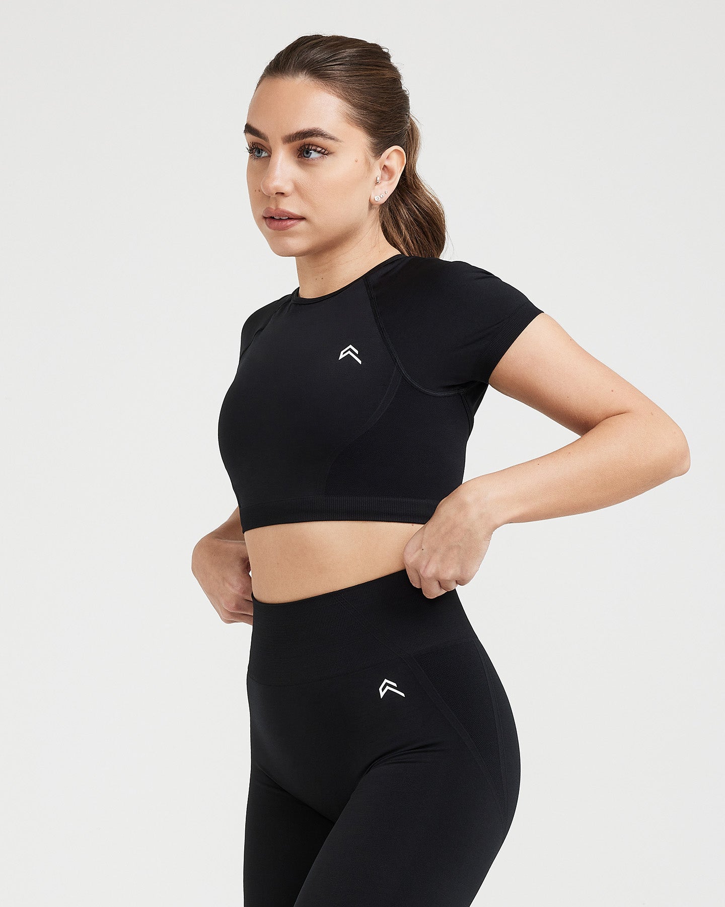 Effortless Seamless Short Sleeve Crop Top with White Logo | Black