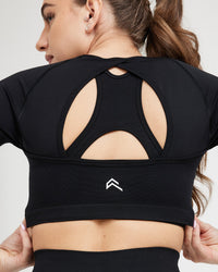 Effortless Seamless Short Sleeve Crop Top with White Logo | Black