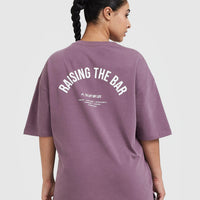 Raising The Bar Graphic Unisex T-Shirt | Vintage Purple
