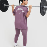 Raising The Bar Graphic Unisex T-Shirt | Vintage Purple