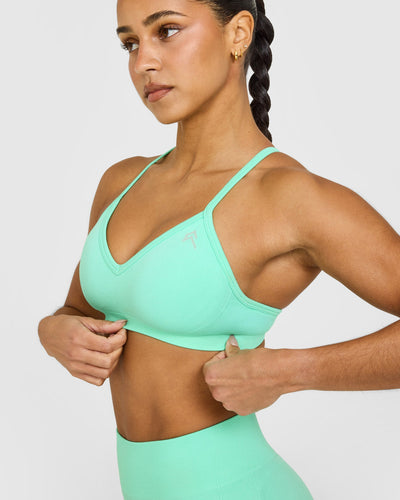 EnhanceLift™ Seamless Strappy Sports Bra with White Logo | Peppermint Green