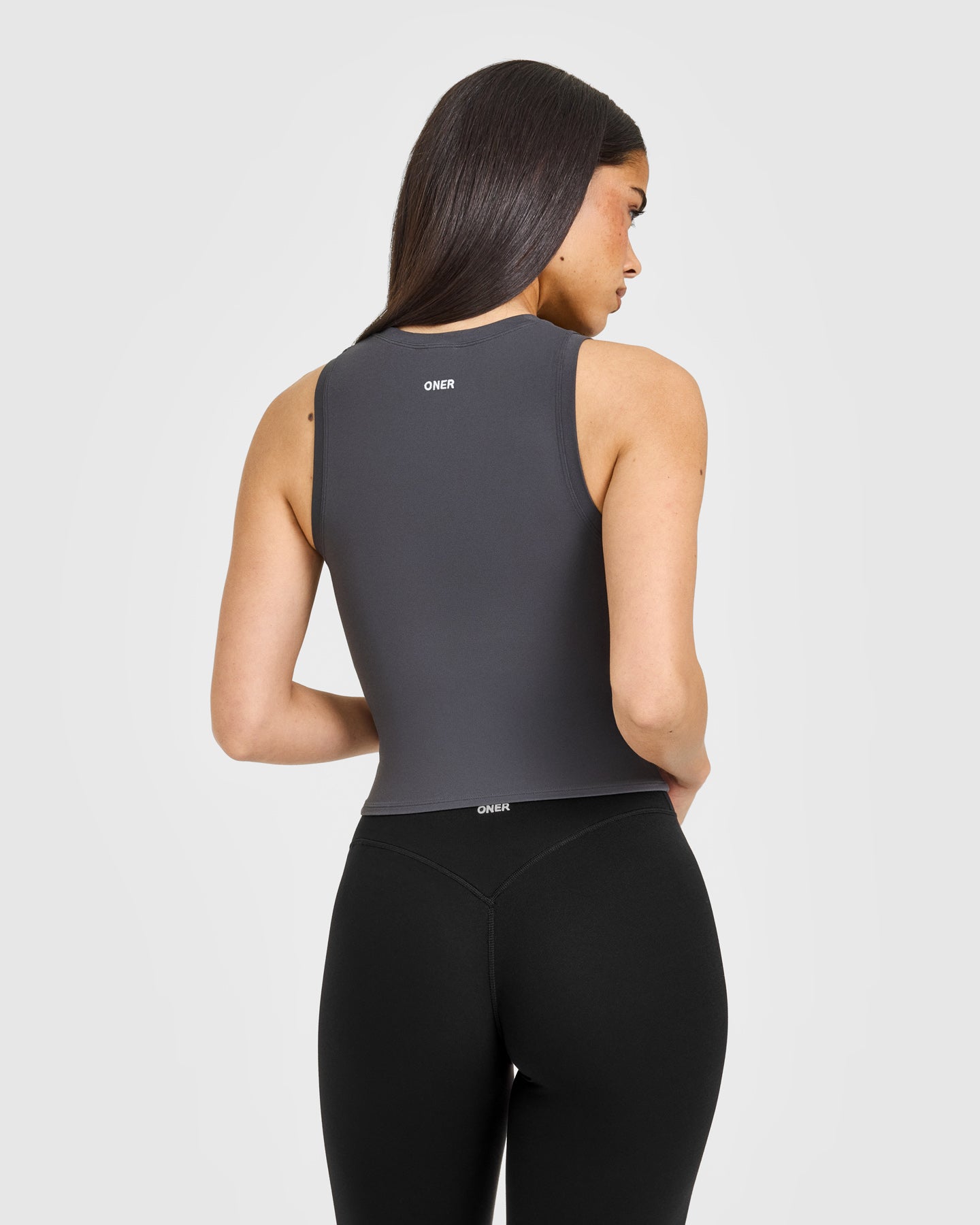 SoftMotion™ High Neck Mid Vest with White Logo | Coal