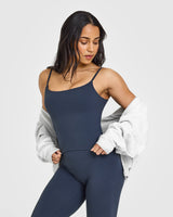 SoftMotion™ Strappy Mid Vest with Built in Bra Shelf with White Logo | True Blue