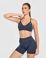 EnhanceLift™ Seamless Strappy Sports Bra with White Logo | True Blue