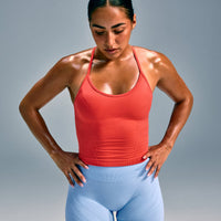 EnhanceLift™ Seamless Strappy Racer Vest with Built in Bra Shelf with Grey Logo | Dark Charged Coral