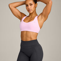 EasyLift™ Cross Back Sports Bra with Grey Logo | Chalk Pink