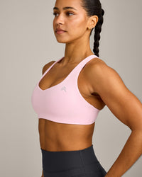 EasyLift™ Cross Back Sports Bra with Grey Logo | Chalk Pink