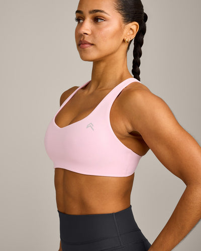 EasyLift™ Cross Back Sports Bra with Grey Logo | Chalk Pink