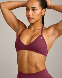 EnhanceLift™ Seamless Minimal Halter Neck Bralette with Grey Logo | Burnt Maroon