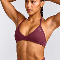 EnhanceLift™ Seamless Minimal Halter Neck Bralette with Grey Logo | Burnt Maroon