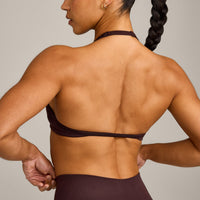 EnhanceLift™ Seamless Minimal Halter Neck Bralette with Grey Logo | Plum Brown