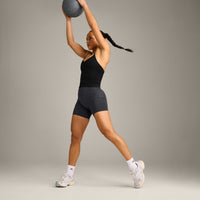 EnhanceLift™ Seamless Strappy Racer Vest with Built in Bra Shelf with Grey Logo | Black