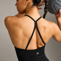 EnhanceLift™ Seamless Strappy Racer Vest with Built in Bra Shelf with Grey Logo | Black