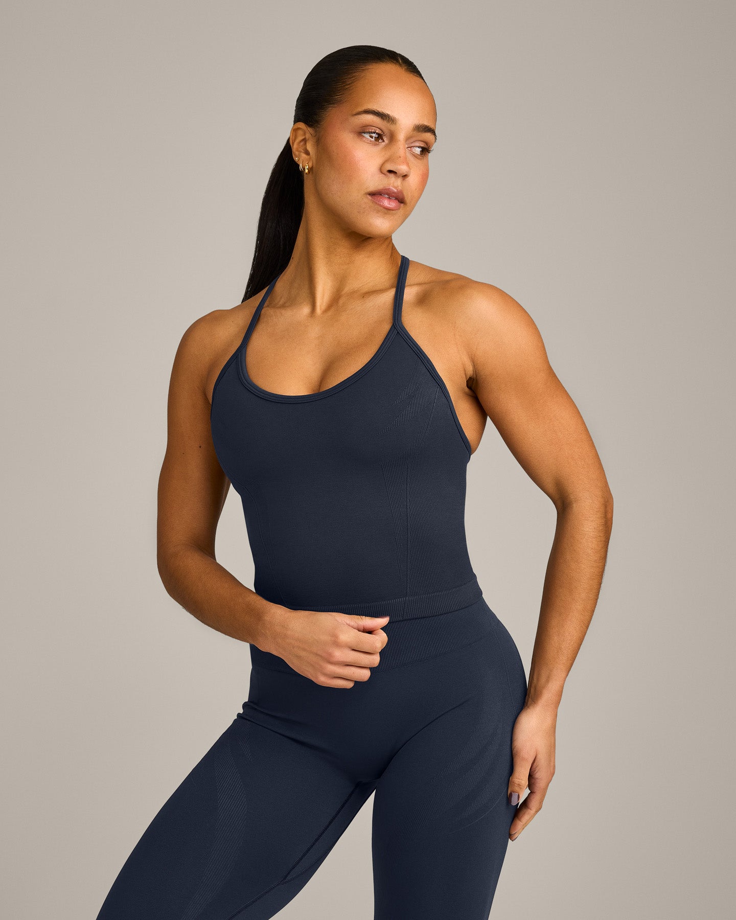 EnhanceLift™ Seamless Strappy Racer Vest with Built in Bra Shelf with Grey Logo | True Blue