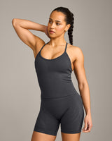 EnhanceLift™ Seamless Strappy Racer Vest with Built in Bra Shelf with Grey Logo | Coal