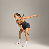 EnhanceLift™ Seamless Strappy Racer Vest with Built in Bra Shelf with Grey Logo | Coal