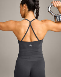 EnhanceLift™ Seamless Strappy Racer Vest with Built in Bra Shelf with Grey Logo | Coal