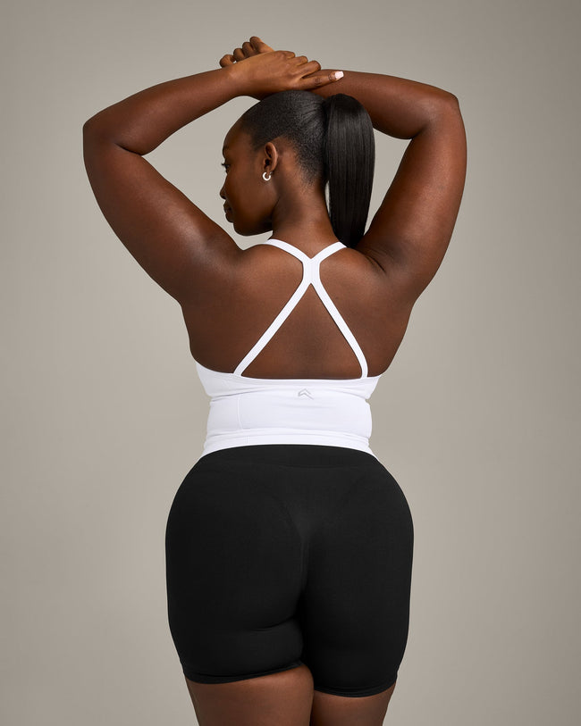 EnhanceLift™ Seamless Strappy Racer Vest with Built in Bra Shelf with Grey Logo | White