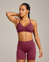 EnhanceLift™ Seamless Strappy Sports Bra with Grey Logo | Burnt Maroon