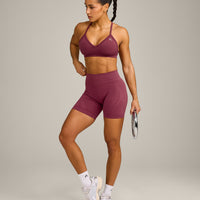 EnhanceLift™ Seamless Strappy Sports Bra with Grey Logo | Burnt Maroon