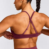 EnhanceLift™ Seamless Strappy Sports Bra with Grey Logo | Burnt Maroon