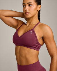 EnhanceLift™ Seamless Strappy Sports Bra with Grey Logo | Burnt Maroon