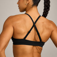 EnhanceLift™ Seamless Strappy Sports Bra with Grey Logo | Black