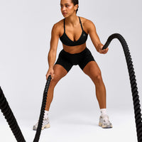EnhanceLift™ Seamless Strappy Sports Bra with Grey Logo | Black